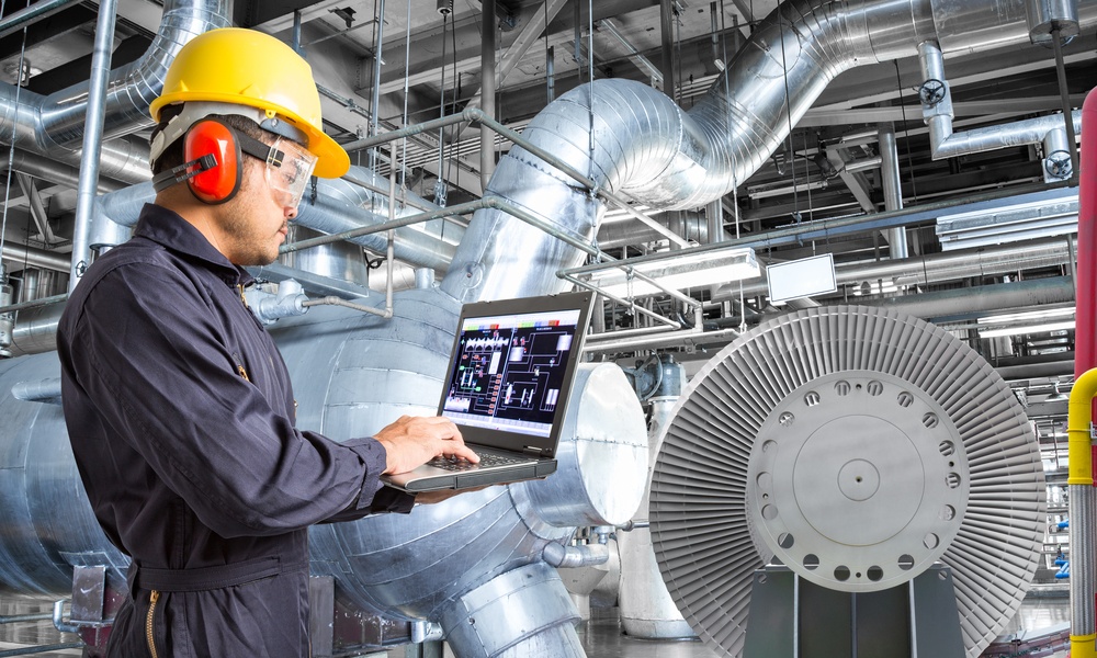 Engineer Using Laptop Computer For Maintenance In Thermal Power