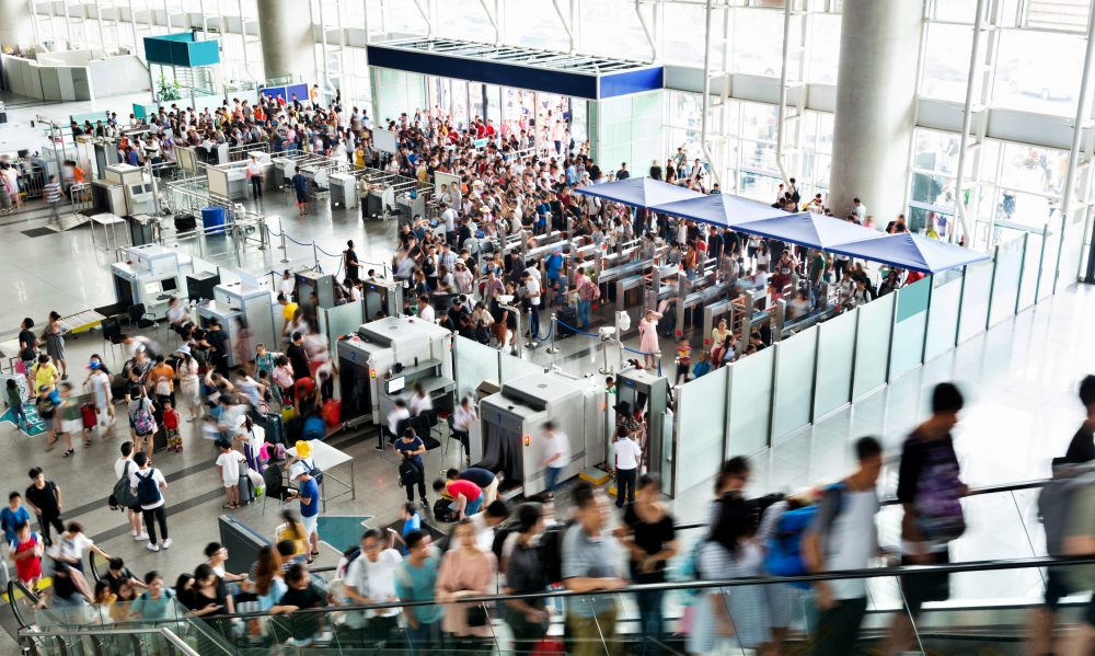 Crowd of people on railroad station lobby