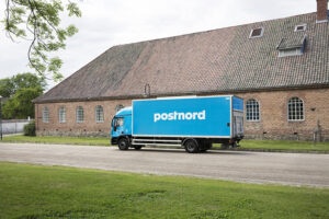 postnord truck near building