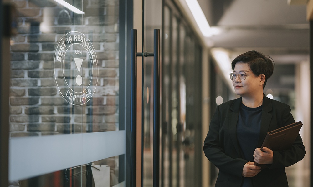 Business Woman Walking In The Corridor In The Office