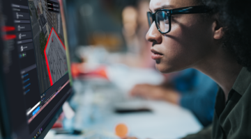 person looking intently at computer screen