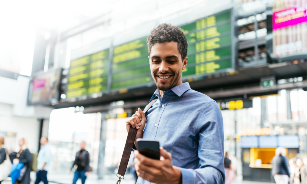 person on business travel with mobile app to access travel safety information