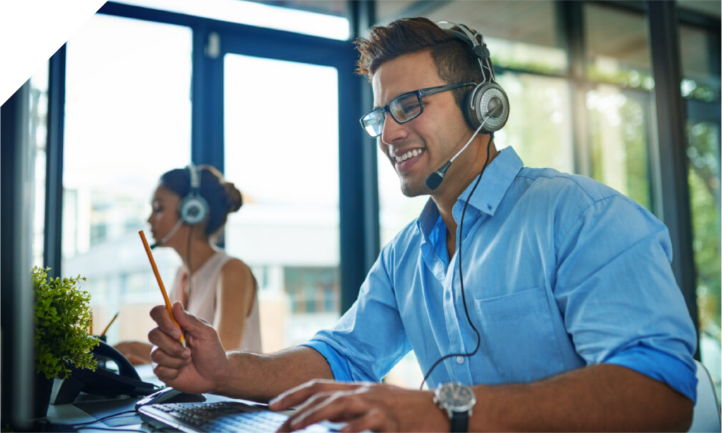 Person Looking At Computer With Headset Web