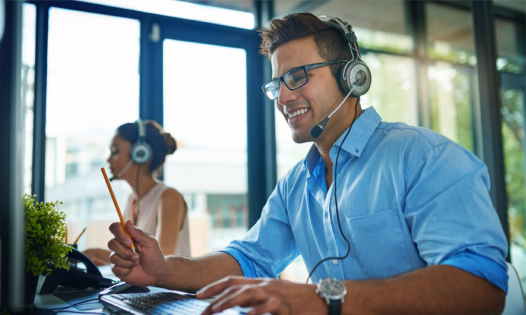 Person Looking At Computer With Headshet