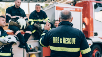 Firemen sitting and discussing