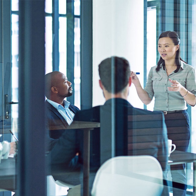 Employees in boardroom