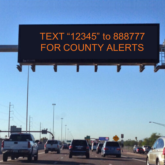 Traffic Sign On Highway showing minutes for traffic delays