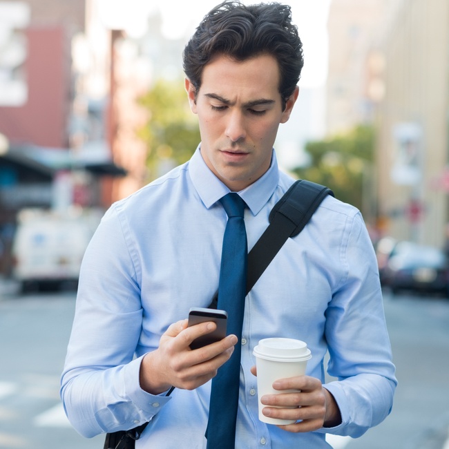 Man Texting On Phone