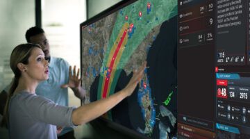 Woman managing a hurricane with critical event management technology