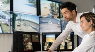 security professionals reviewing CCTV in control room
