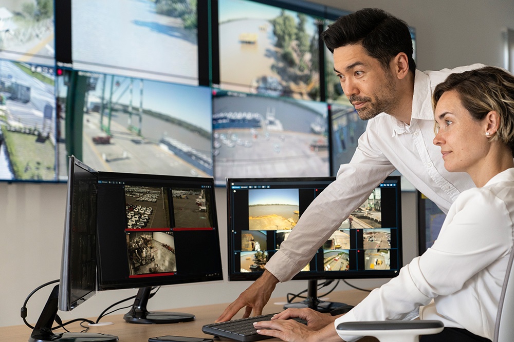 security professionals reviewing CCTV in control room
